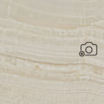 Beige Caesarstone surface with natural veining and the text ‘View in your room’